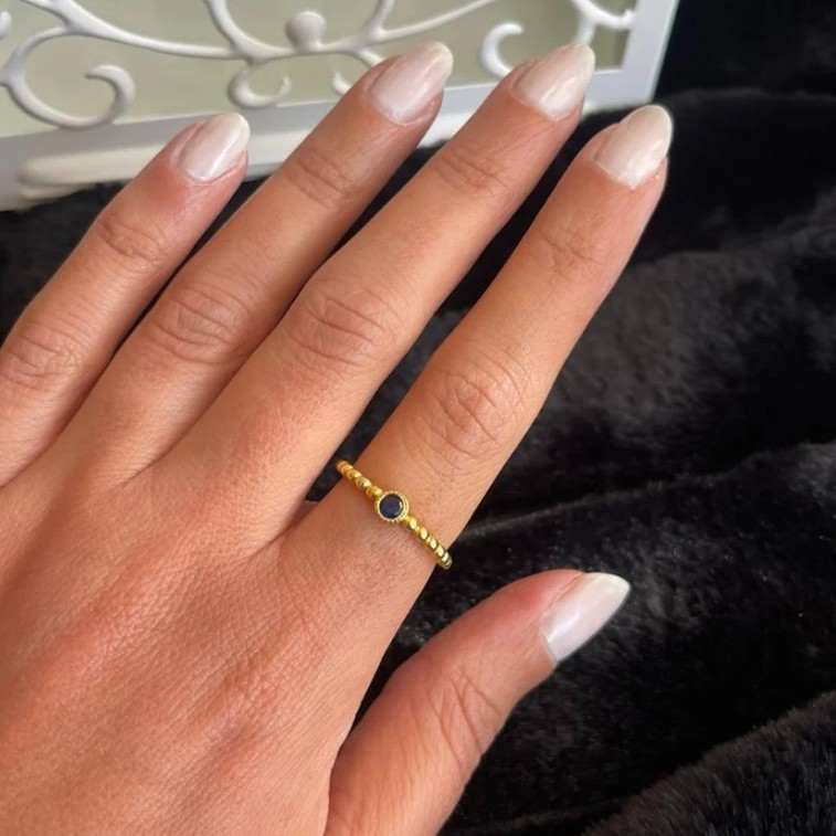 Braided silver ring with blue stone gold plated