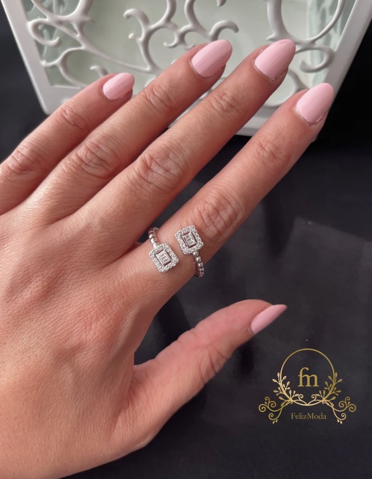 Silver braided ring with two squares zircon stones