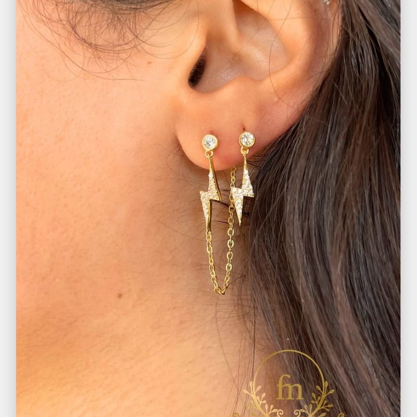 Two pieces flash star silver earrings one plain , one with connected chain gold plated