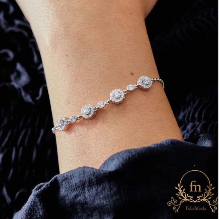 Silver bracelet with 4 round zircon stones